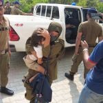 Police escort British-Pakistani children after appearing at a local court in Jhelum, Pakistan, 12 September 2023. A judge in Pakistan has ruled that the siblings of Sara Sharif, who was found dead in her home in Woking, UK last month, should be placed in a government childcare facility. 