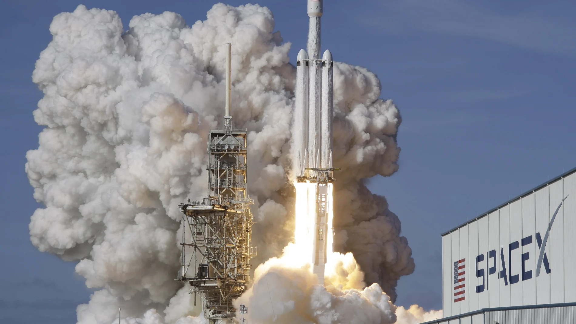 A Falcon 9 SpaceX heavy rocket lifts off from pad 39A at the Kennedy Space Center in Cape Canaveral, Fla.