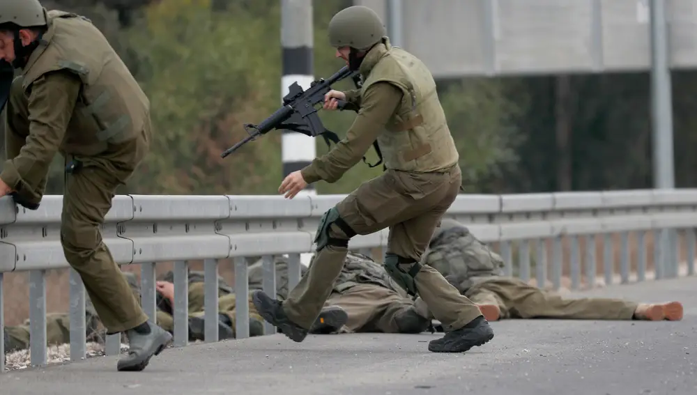 Israeli military tries to strengthen borders with Gaza as battle enters third day