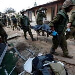 Israeli army remove bodies from Kfar Aza kibbutz