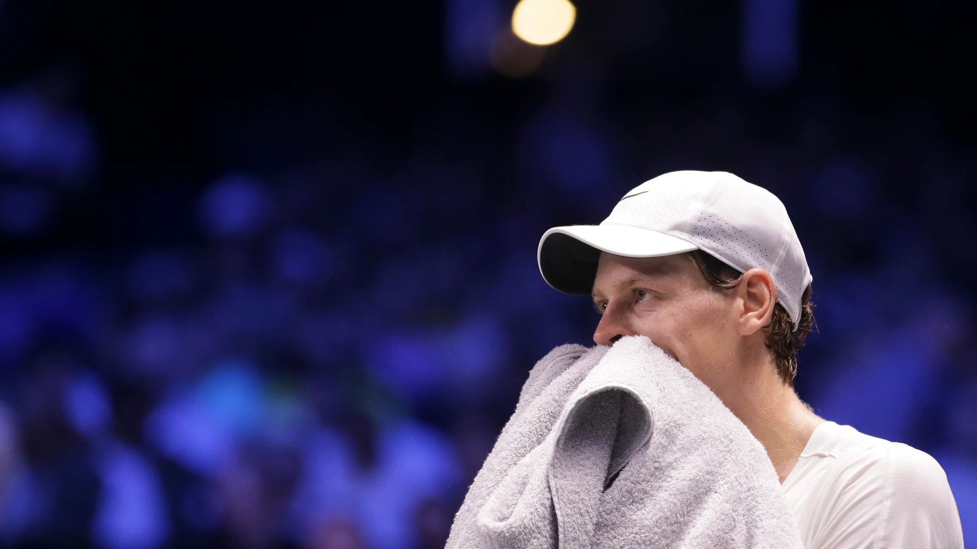Jannik Sinner of Italy wipes off sweat during a final match against Daniil Medvedev of Russia at the Erste Bank Open ATP tennis tournament in Vienna, Austria, Sunday, Oct. 29, 2023. (AP Photo/Heinz-Peter Bader)