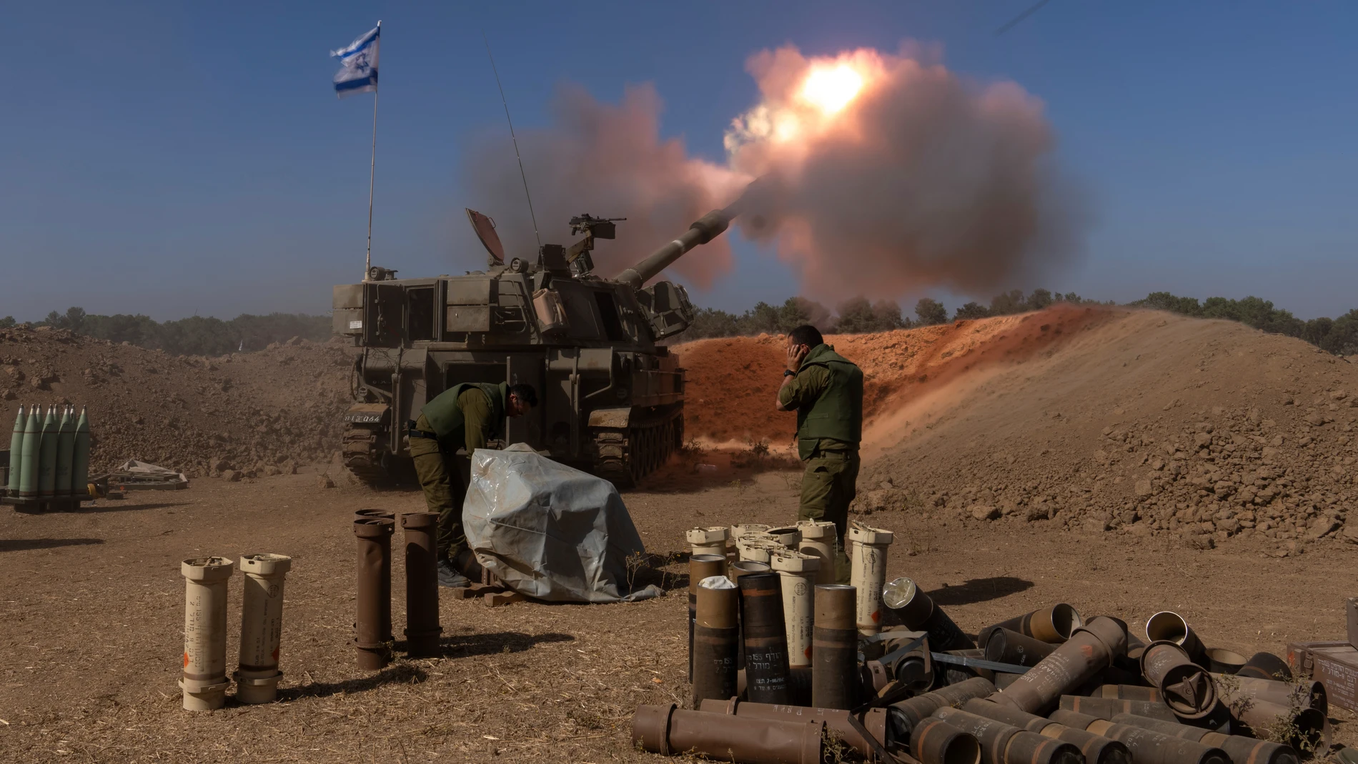 FILE - An Israeli mobile artillery unit fires a shell from southern Israel towards the Gaza Strip, in a position near the Israel-Gaza border, Nov. 6, 2023.Americans have become more likely to describe Israel as an ally that shares U.S. interests and values since the war with Hamas began, but they're divided over whether Israel has gone too far in its response to last month's attack, according to a new poll from The Associated Press-NORC Center for Public Affairs Research. (AP Photo/Ohad Zwige...
