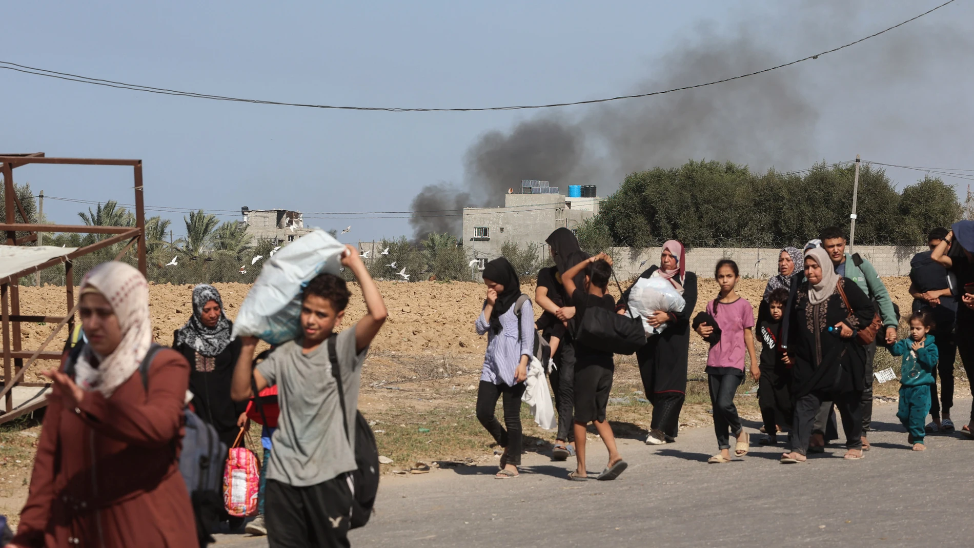 November 10, 2023, Gaza, Palestine: Palestinian families fleeing Gaza City and other parts of northern Gaza towards the southern areas, walk along a road amid ongoing battles between Israel and the Palestinian Hamas movement. Thousands of Palestinians have been fleeing heavy combat between Hamas militants and the Israeli military in Gaza City a month after Hamas, based in the Gaza Strip, entered southern Israel on October 7, in an unprecedented attack triggering a war declared by Israel on Ha...