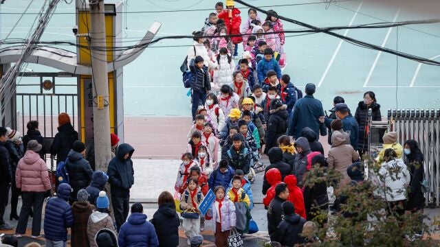 Students are dismissed from a school in Beijing, China, 23 November 2023. The World Health Organization (WHO) made an official request to China for detailed information following an increase of respiratory diseases and reported clusters of pneumonia in children in northern China.