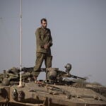 Israeli soldiers maneuver along Gaza border