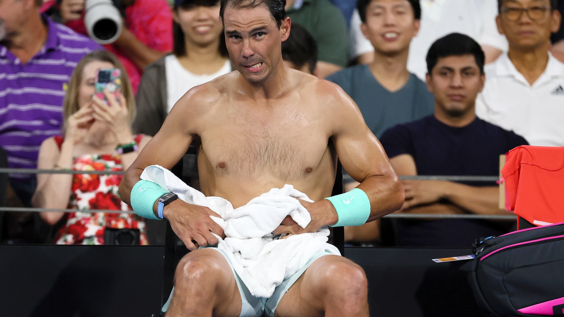 Rafael Nadal of Spain changes his shirt in his match against Dominic Thiem of Austria during the Brisbane International tennis tournament in Brisbane, Australia, Tuesday, Jan. 2, 2024. (AP Photo/Tertius Pickard)