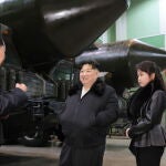 North Korean leader Kim Jong Un inspects missile launcher factory with his daughter