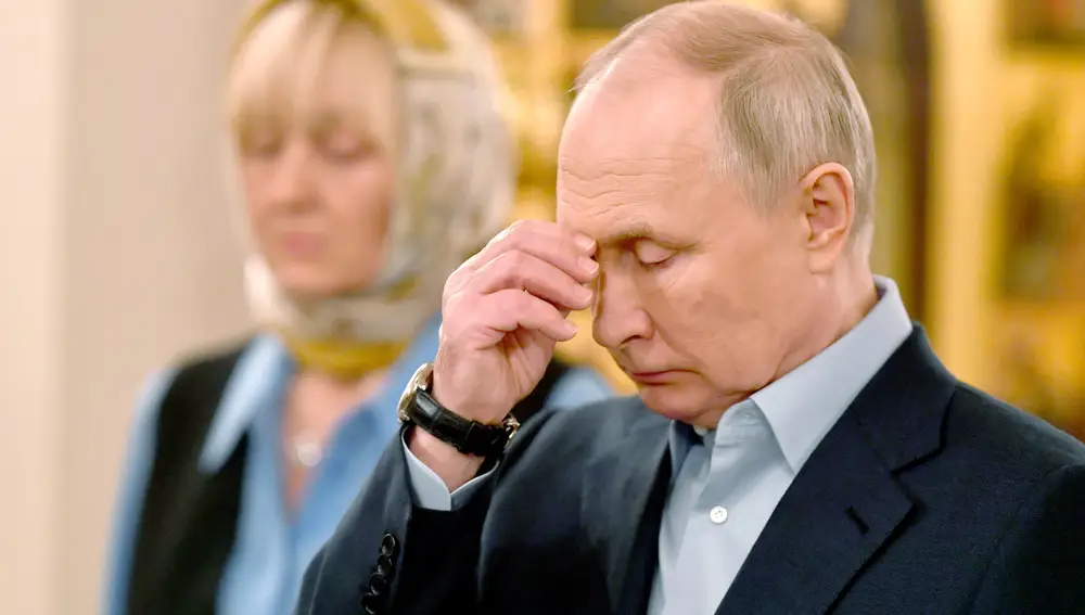 Russian President Vladimir Putin attends a Christmas service