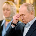 Russian President Vladimir Putin attends a Christmas service