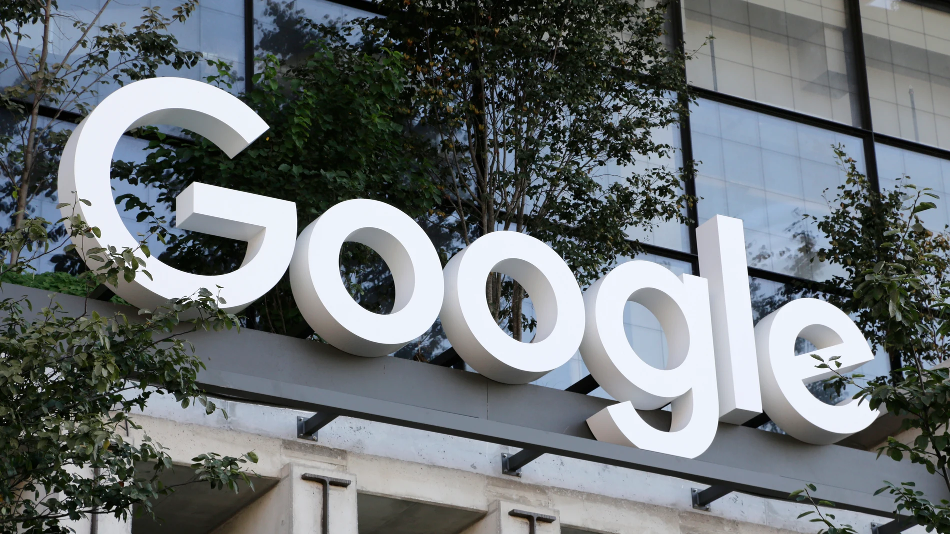 FILE - The Google sign is shown over an entrance to the company's new building in New York on Wednesday, Sept. 6, 2023. A legal advisor to the European Union's top court said Thursday that Google should still pay a whopping fine in a long-running antitrust case in which regulators found the company gave its own shopping recommendations an illegal advantage over rivals in search results. (AP Photo/Peter Morgan, File)