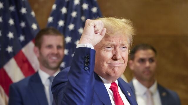 Eric Trump, left, smiles as Former President Donald Trump thanks supporters who were cheering him on after a news conference, Thursday, Jan. 11, 2024, in New York.