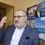 Boris Nadezhdin, the Civic Initiative Party presidential hopeful, talks to an AFP reporter by his campaign posters from past regional elections at his flat in Dolgoprudnyy on January 24, 2024.