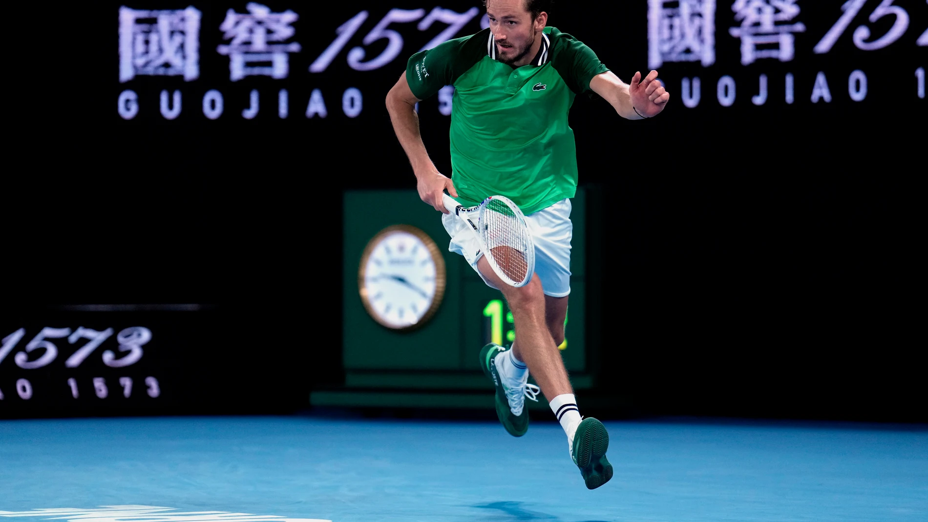 Daniil Medvedev of Russia runs to return a shot to Alexander Zverev of Germany during their semifinal at the Australian Open tennis championships at Melbourne Park, Melbourne, Australia, Friday, Jan. 26, 2024. (AP Photo/Andy Wong)