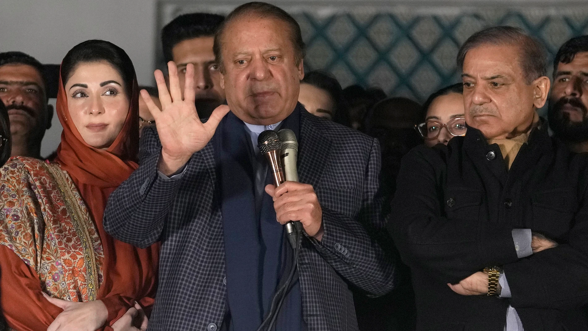 Pakistan's Former Prime Minister Nawaz Sharif, center, addresses supporters next to his brother Shehbaz Sharif, right, and daughter Maryam Nawaz following initial results of the country's parliamentary election, in Lahore, Pakistan, Friday, Feb. 9, 2024. Sharif is changing tack and said on Friday that he will seek to form a coalition government after his party trailed the independent candidates of his rival Imran Khan in preliminary results following the country’s parliamentary election. (AP ...