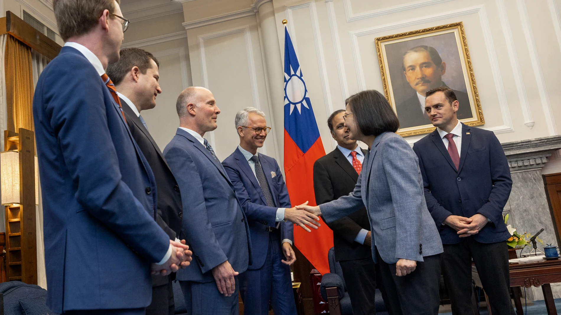 In this photo released by the Taiwan Presidential Office, Taiwan's President Tsai Ing-wen, second right, shakes hands with members of United States Congressmen as Rep. Mike Gallagher, the Republican chair of the House Select Committee on the Chinese Communist Party, right, looks on during a meeting in Taipei, Taiwan, Thursday, Feb. 22, 2024. A group of United States Congress members met with Taiwan's president Thursday in a show of support that's certain to draw scrutiny from China, which opp...