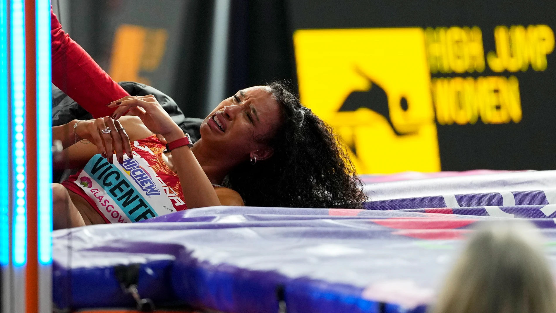 Maria Vicente, of Spain cries after getting injured in the Pentathlon high jump during the World Athletics Indoor Championships at the Emirates Arena in Glasgow, Scotland, Friday, March 1, 2024. (AP Photo/Petr David Josek)