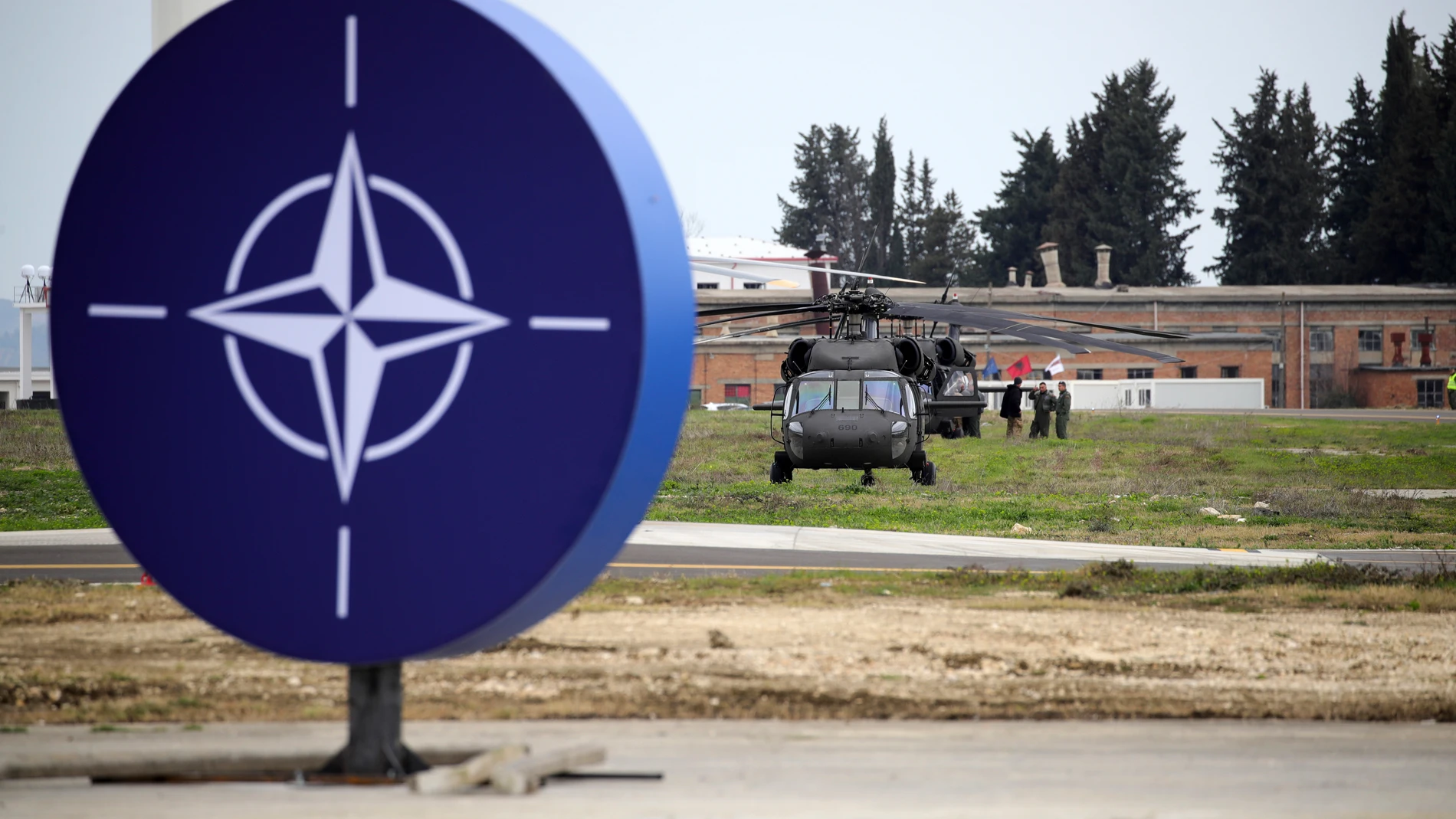 Military helicopters are parked at an airbase in Kocuve, about 85 kilometers (52 miles) south of Tirana, Albania, Monday, March 4, 2024. NATO member Albania inaugurated an international tactic air base on Monday, the Alliance’s first one in the Western Balkan region. (AP Photo/Armando Babani)