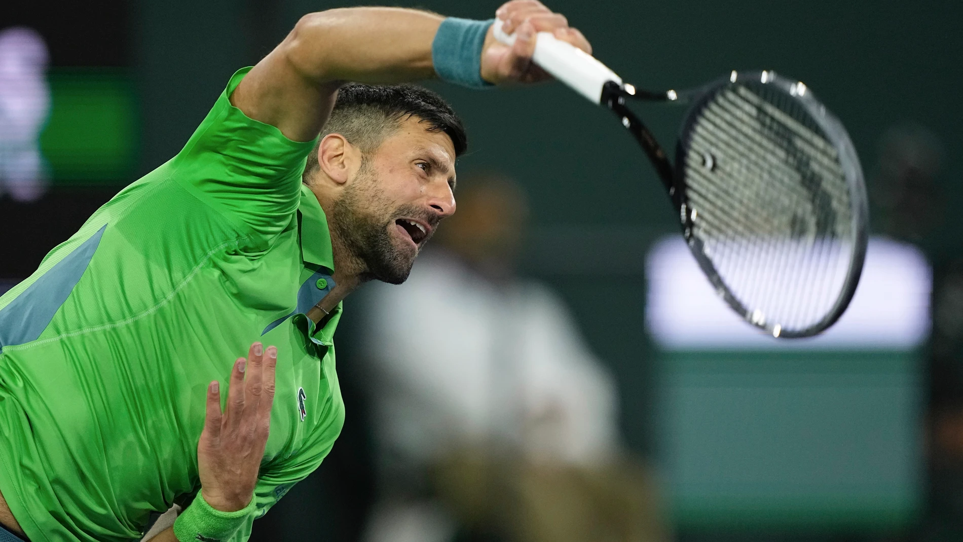 Novak Djokovic, of Serbia, serves to Luca Nardi, of Italy, at the BNP Paribas Open tennis tournament Monday, March 11, 2024, in Indian Wells, Calif. Nardi won 6-4, 3-6, 6-3. (AP Photo/Mark J. Terrill)