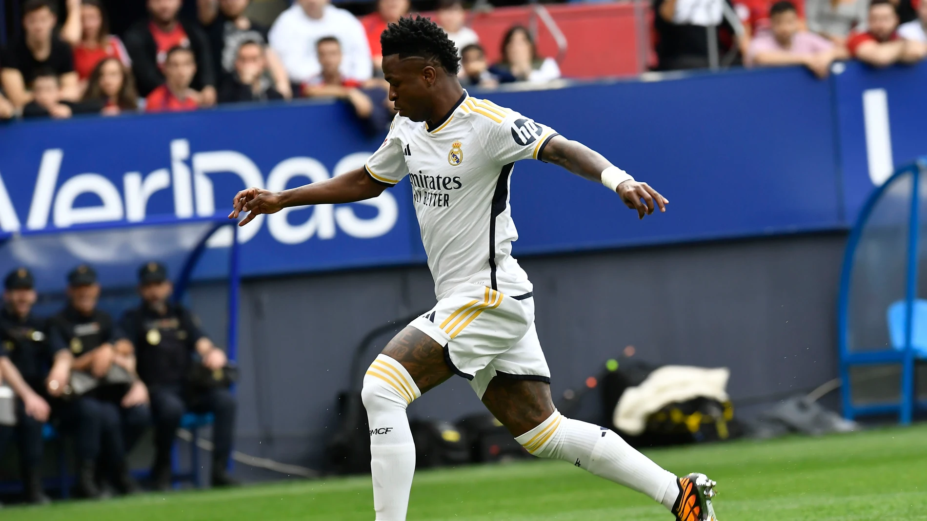 Real Madrid's Vinicius Junior scores his side's opening goal during the Spanish La Liga soccer match between Osasuna and Real Madrid at the El Sadar stadium in Pamplona, Spain, Saturday, March 16, 2023. (AP Photo/Alvaro Barrientos)