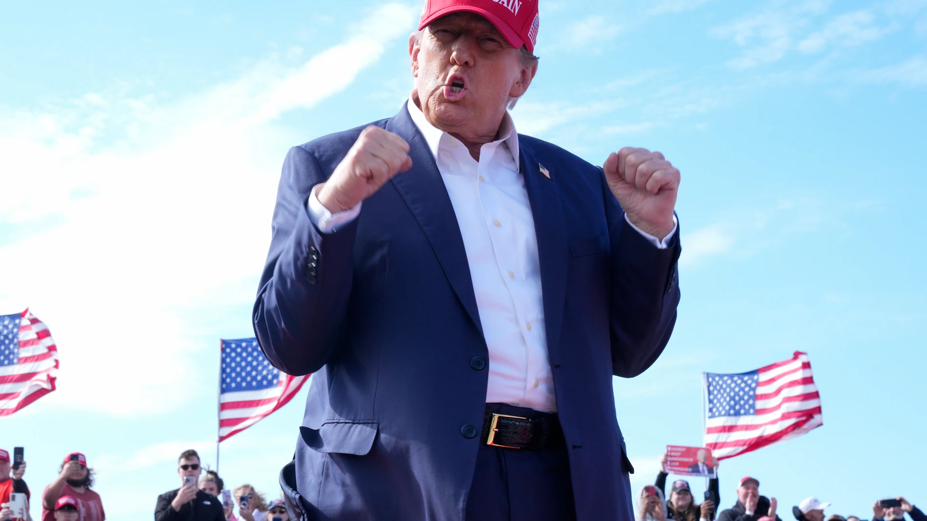 Republican presidential candidate former President Donald Trump gestures to the crowd at a campaign rally Saturday, March 16, 2024, in Vandalia, Ohio. (AP Photo/Jeff Dean)
