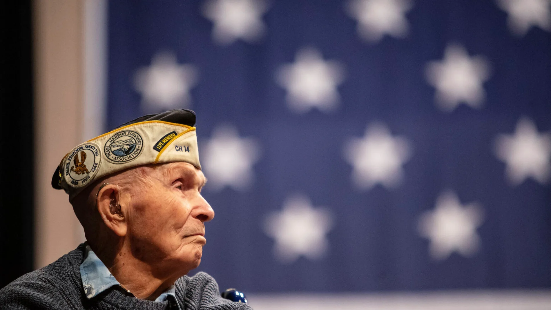 Pearl Harbor survivor Dick Higgins listens to a speaker during a ceremony at Bend High School in Bend, Ore., on Dec. 7, 2023, to honor him as well as those who died in the Dec. 7, 1941 attack on Pearl Harbor. Higgins, one of the few remaining survivors of the Japanese attack on Pearl Harbor, died Tuesday, March 19, 2024, at his home in Bend, Ore. He was 102. (Joe Kline/The Bulletin via AP)