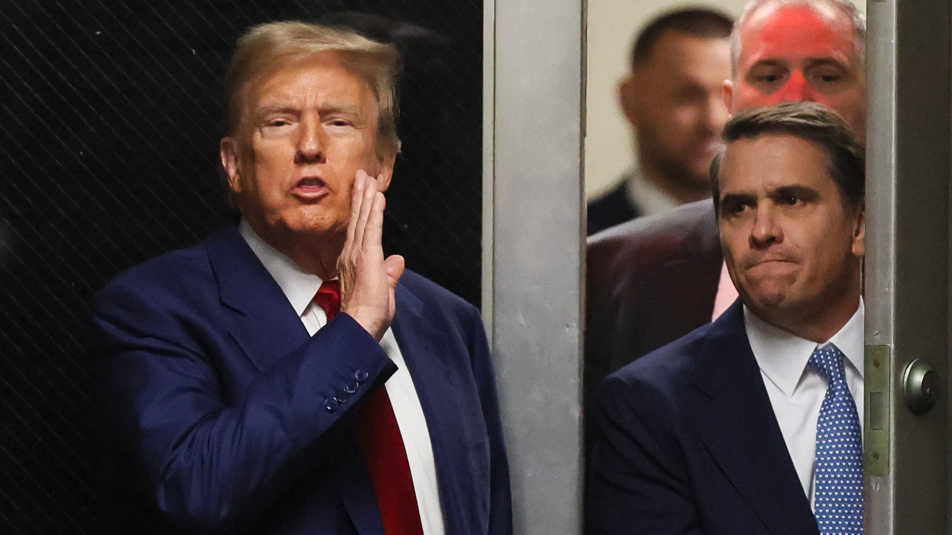 Former President Donald Trump speaks from a hallway outside a courtroom where he is attending a hearing at New York Criminal Court, Monday, March 25, 2024, in New York. 2024. (Brendan McDermid/Pool Photo via AP)