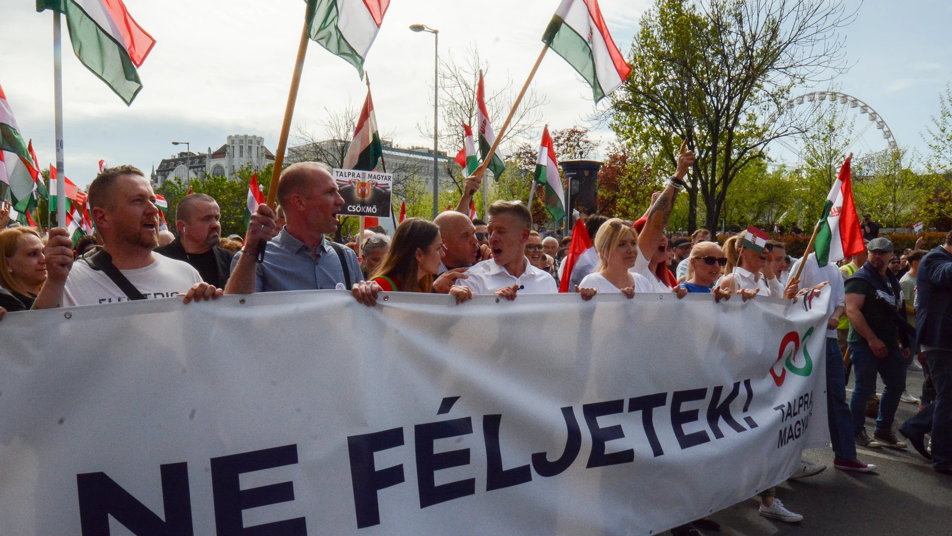 Peter Magyar, a former insider within Hungary's ruling Fidesz party, a political newcomer, leads people with a banner that reads: "Do not be afraid!" during a protest on Saturday, April 6, 2024. A rising challenger to Hungarian Prime Minister Viktor Orbán mobilized tens of thousands of supporters outlining a plan to unite the country and bring an end to the populist leader's 14-year hold on power. (AP Photo/Justin Spike)
