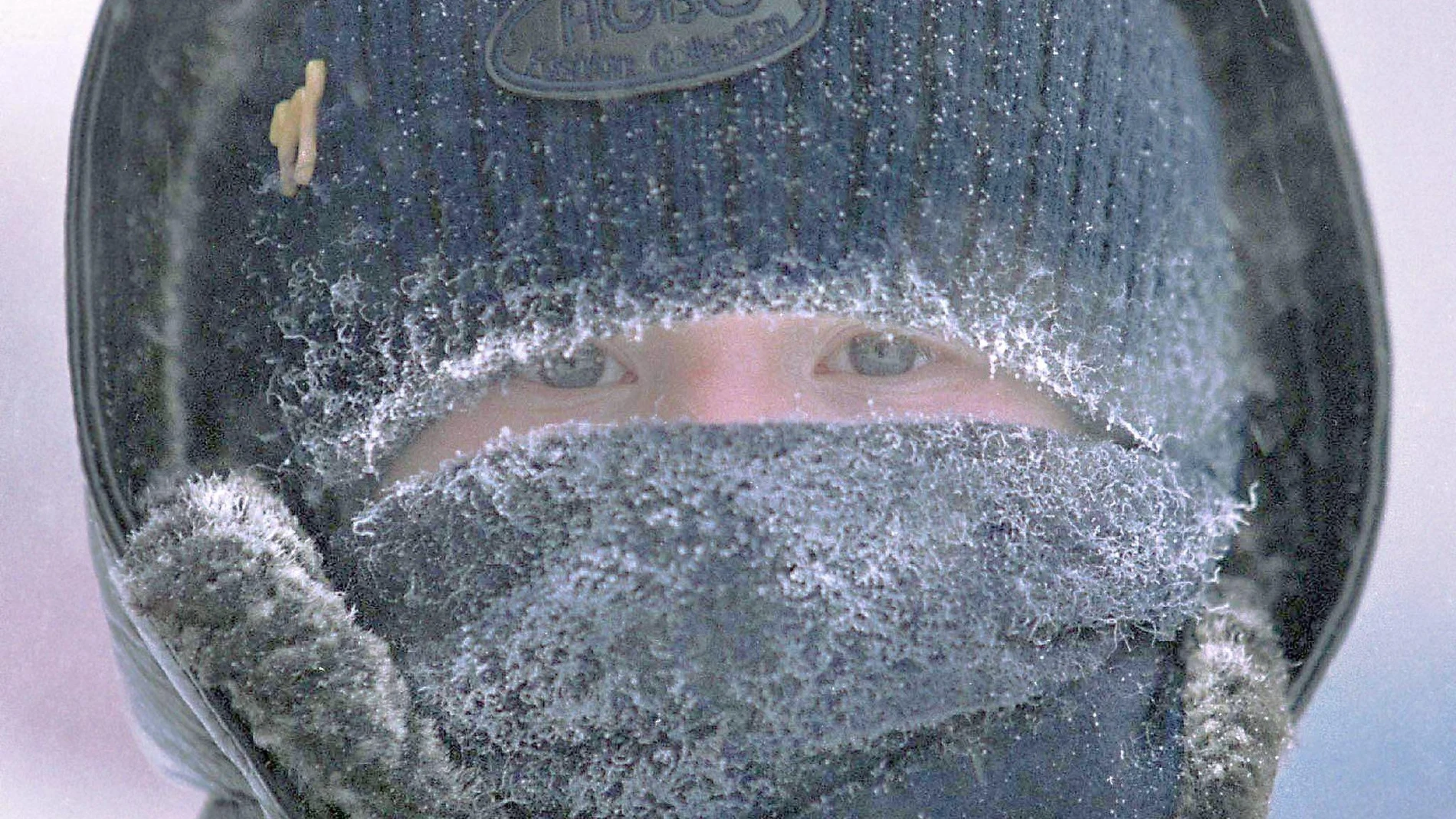 A small boy protects his face frome extreme cold in Novosibirsk.