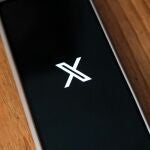 Portaltic.-X (Twitter) para iOS modifica automáticamente a 'x.com' los dominios en menciones a otras cuentas