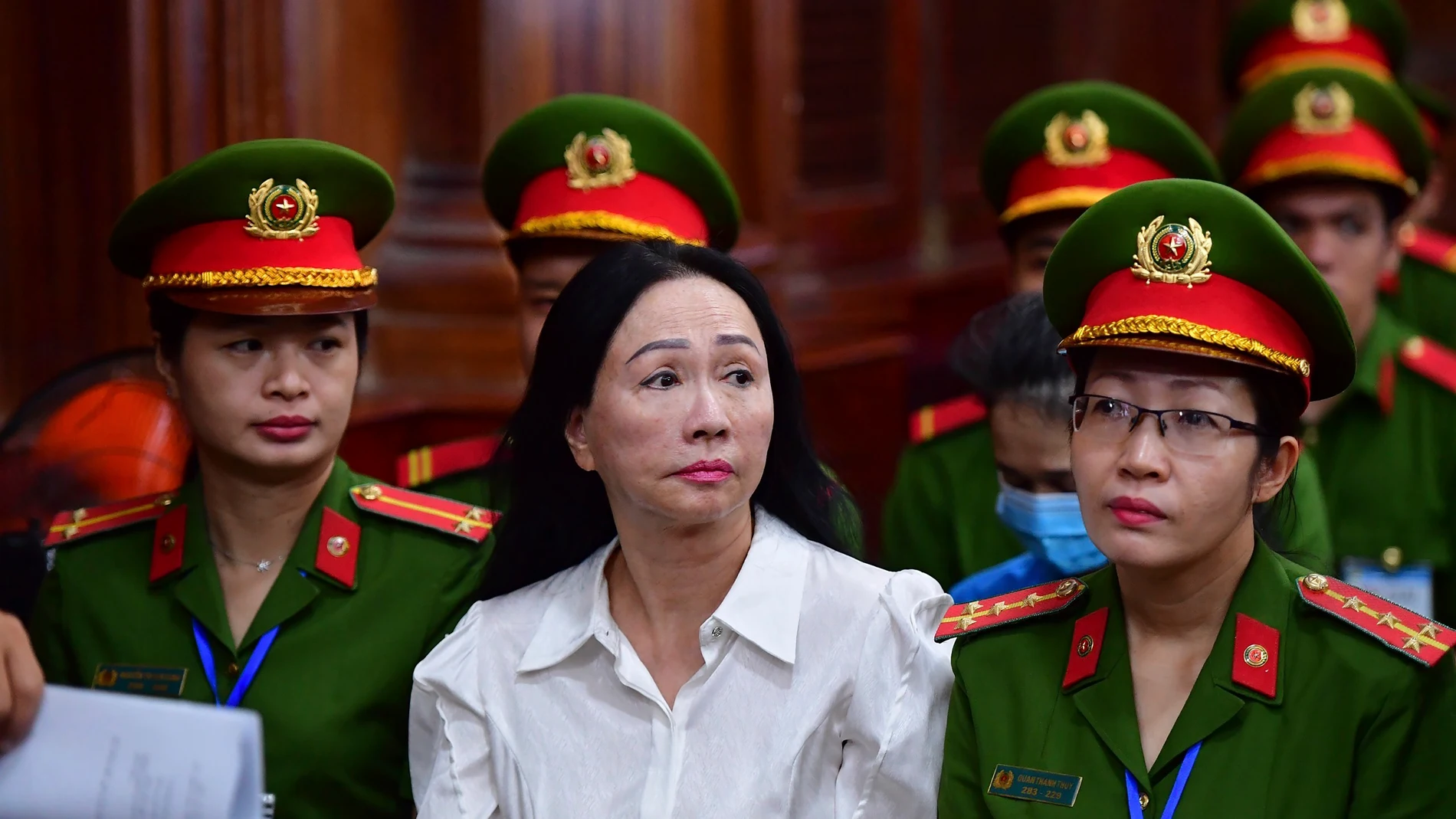 Business woman Truong My Lan, front center, attends a trial in Ho Chi Minh City, Vietnam on Thursday, April 11, 2024. The real estate tycoon may face the death penalty if convicted of allegations that she siphoned off an amount of $12.5 billion, nearly 3 percent of Vietnam's 2022 GDP, in its largest financial fraud case. (Thanh Tung/VnExpress via AP)