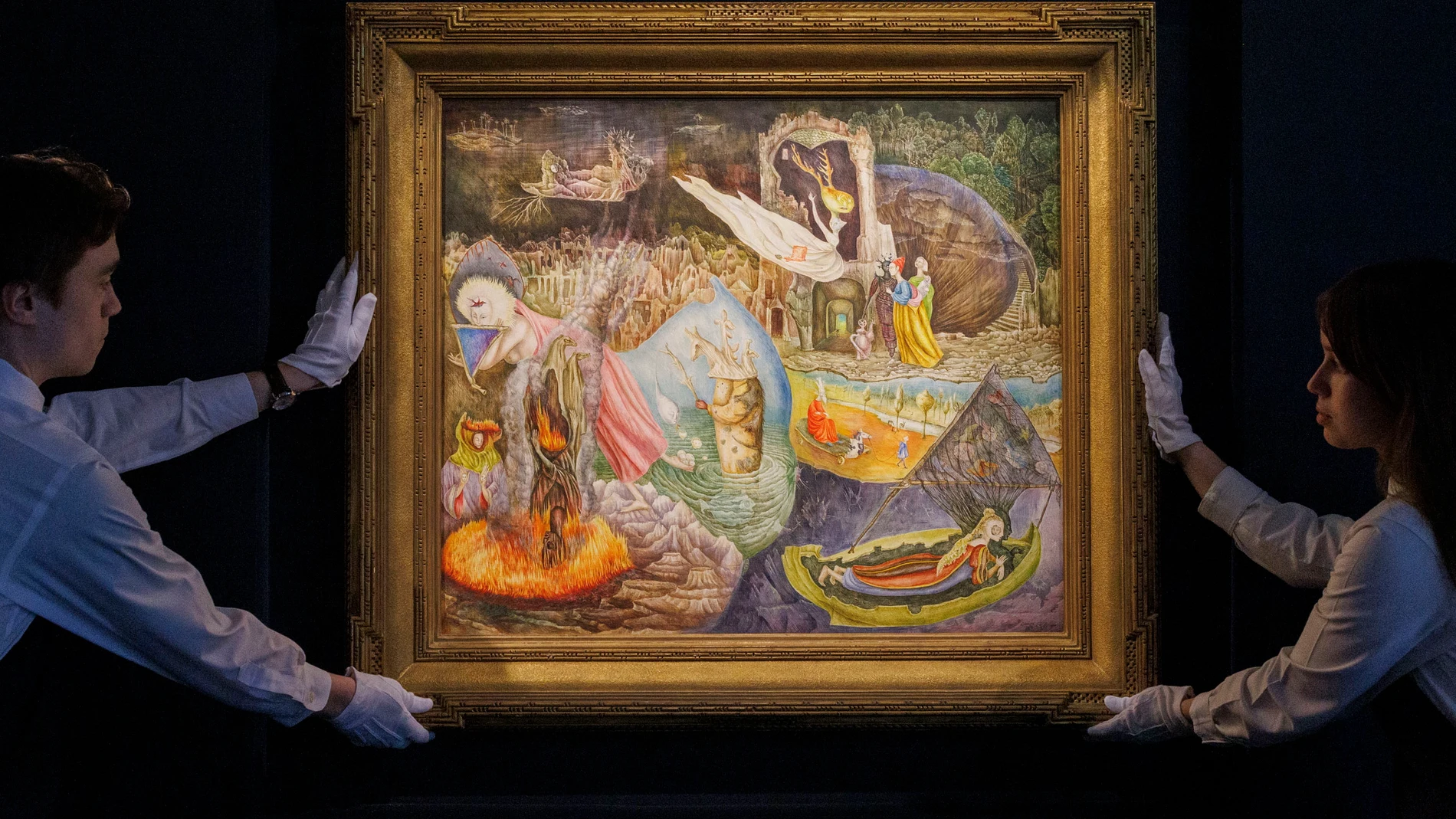 New York (United States), 03/05/2024.- Art handlers poses for the press with Leonora Carrington's 'Les Distractions de Dagobert', on display at Sotheby's auction house in New York, New York, USA, 03 May 2024. Their New York Marquee Evening Sales will take place on 13 and 15 May 2024. (Nueva York) EFE/EPA/SARAH YENESEL