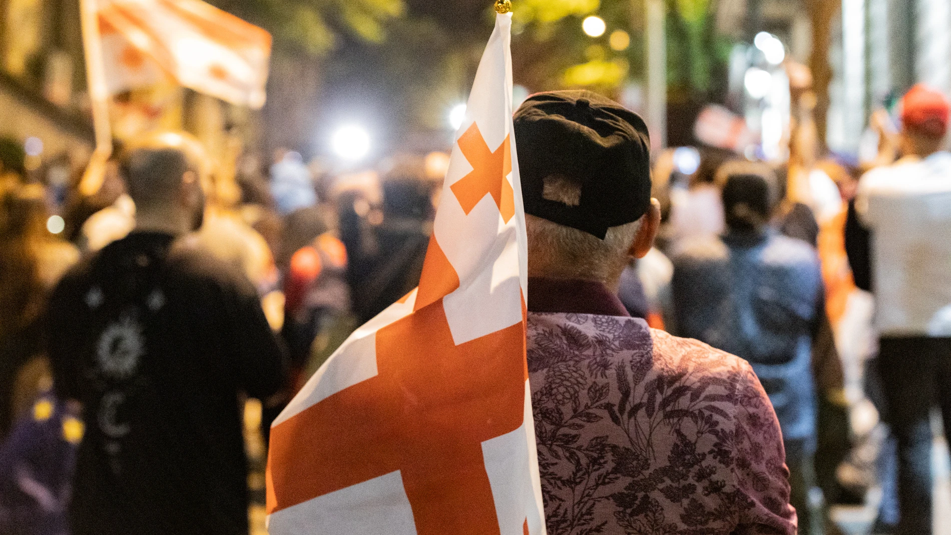 April 28, 2024, Tbilisi, Georgia: A protester with a Georgian flag takes part at a protest against the reintroduction of a bill on 'foreign agents' in central Tbilisi. 28/04/2024