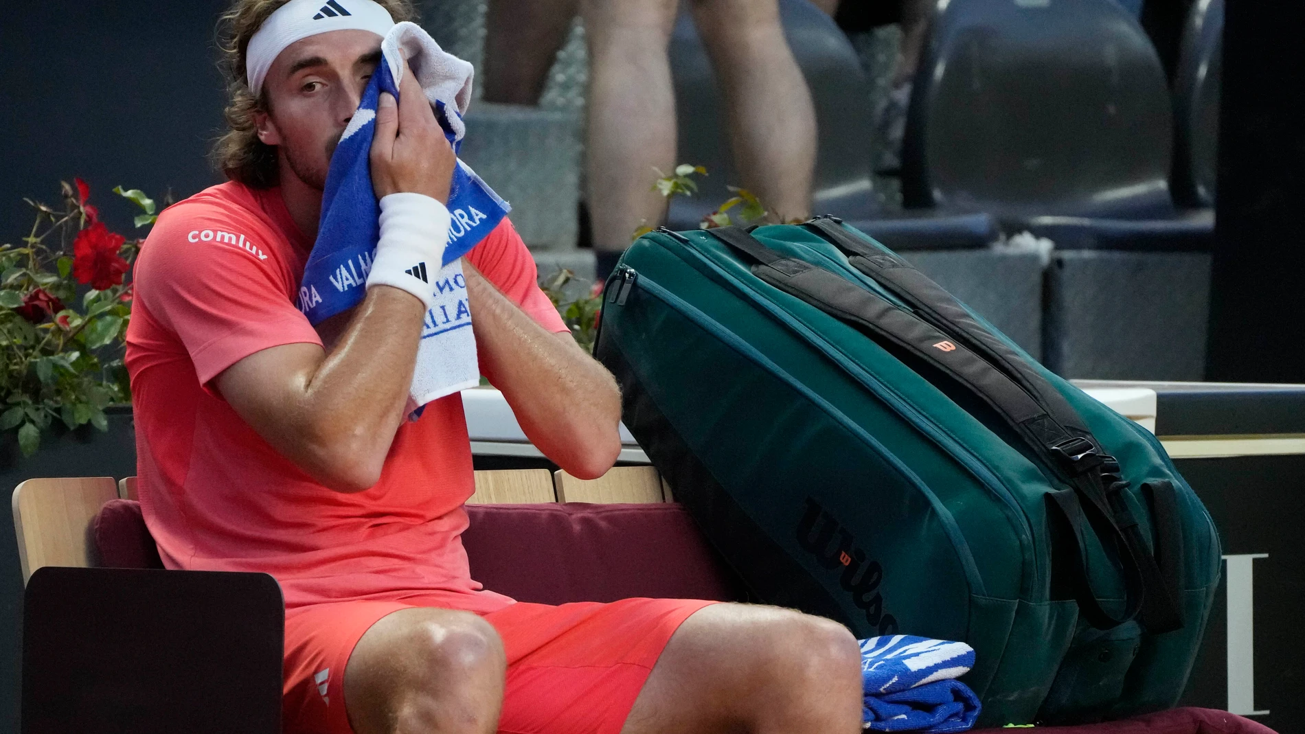 Stefanos Tsitsipas, of Greece, wipes his face during his match against Jan-Lennard Struff, of Germany, at the Italian Open tennis tournament in Rome, Saturday, May 11, 2024.(AP Photo/Gregorio Borgia)