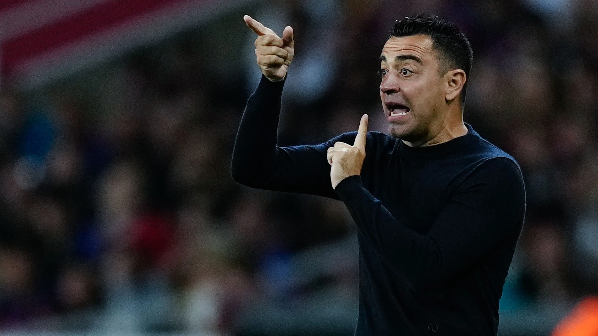 BARCELONA, 13/05/2024.- El entrenador del FC Barcelona, Xavi Hernández, durante el encuentro correspondiente a la jornada 35 en Primera División que FC Barcelona y Real Sociedad disputan hoy lunes en el estadio Olímpico Lluis Companys, en Barcelona. EFE/ Enric Fontcuberta.