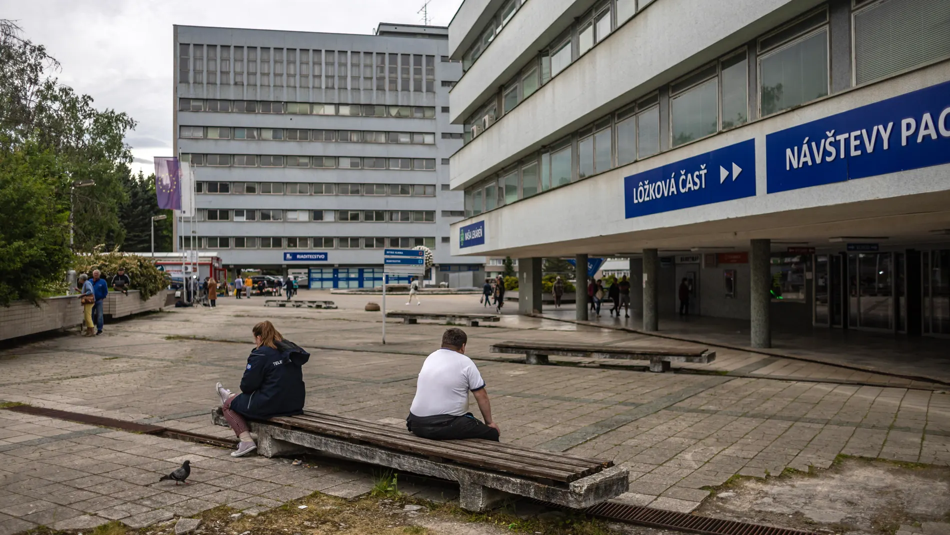 Banska Bystrica (Slovakia (slovak Republic)), 17/05/2024.- People sit outside the F. D. Roosevelt University Hospital, where Slovak Prime Minister Robert Fico is being treated after being shot two days earlier, in Banska Bystrica, Slovakia, 17 May 2024. The Slovak government office on 15 May confirmed there had been an assassination attempt on Prime Minister Robert Fico following a meeting in the town of Handlova. Slovak President-elect Peter Pellegrini, who visited Fico in hospital and spoke...