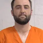 A handout photo made available by the Louisville Police Department showing golfer Scottie Scheffler of USA after his arrest outside the Valhalla Golf Club before the delayed start of the second round of the 2024 PGA Championship golf tournament in Louisville, Kentucky, USA.