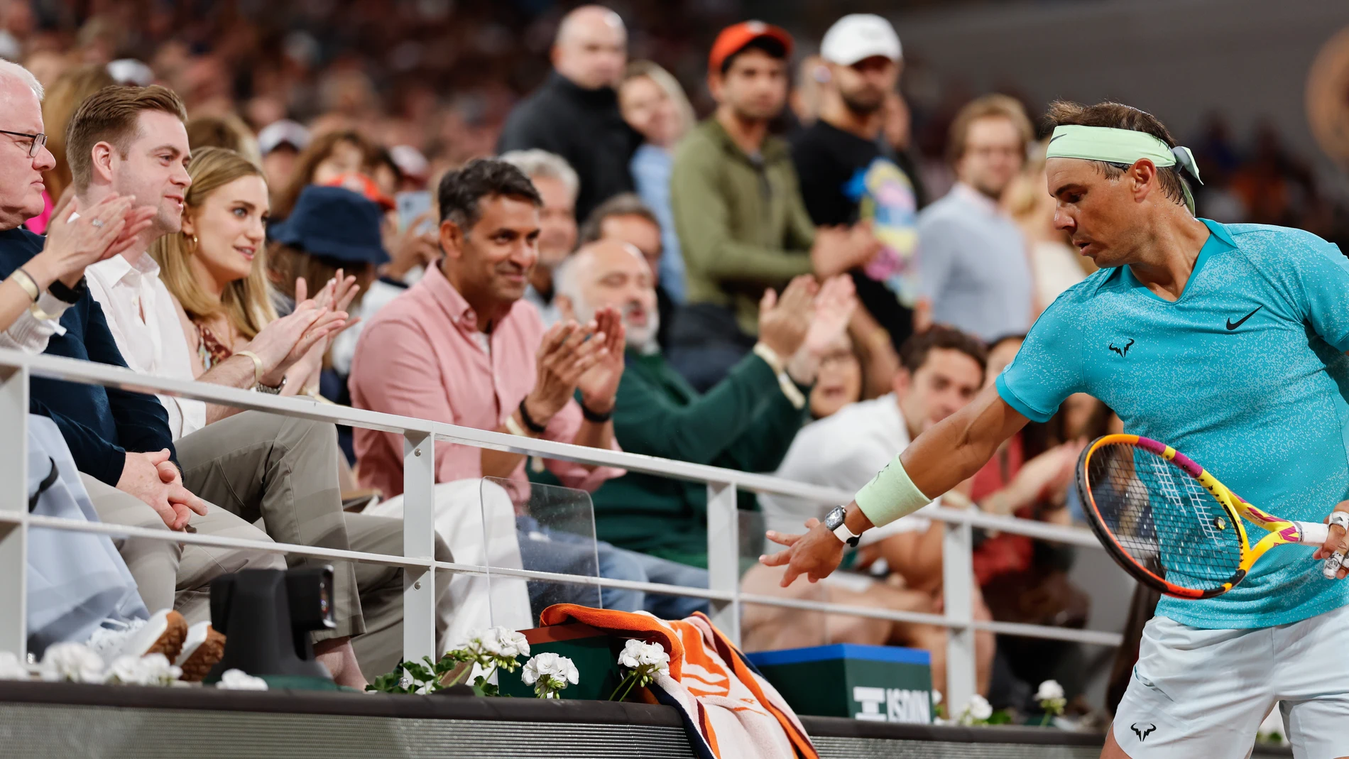 Spectators applaud for Spain's Rafael Nadal during his first round match of the French Open tennis tournament against Germany's Alexander Zverev at the Roland Garros stadium in Paris, Monday, May 27, 2024. (AP Photo/Jean-Francois Badias)