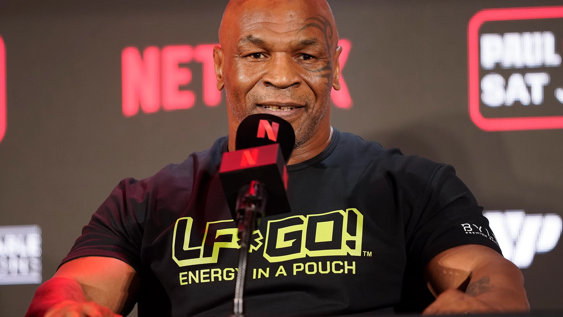 FILE - Mike Tyson speaks during a news conference promoting his upcoming boxing bout against Jake Paul, May 16, 2024, in Arlington, Texas. Tyson was recovering Monday, May 27, after suffering a medical emergency a day earlier during a flight from Miami to Los Angeles, his representatives said. The 58-year-old boxing legend “became nauseous and dizzy due to an ulcer flare up 30 minutes before landing” his publicist's office said in a statement. (AP Photo/Sam Hodde, File)