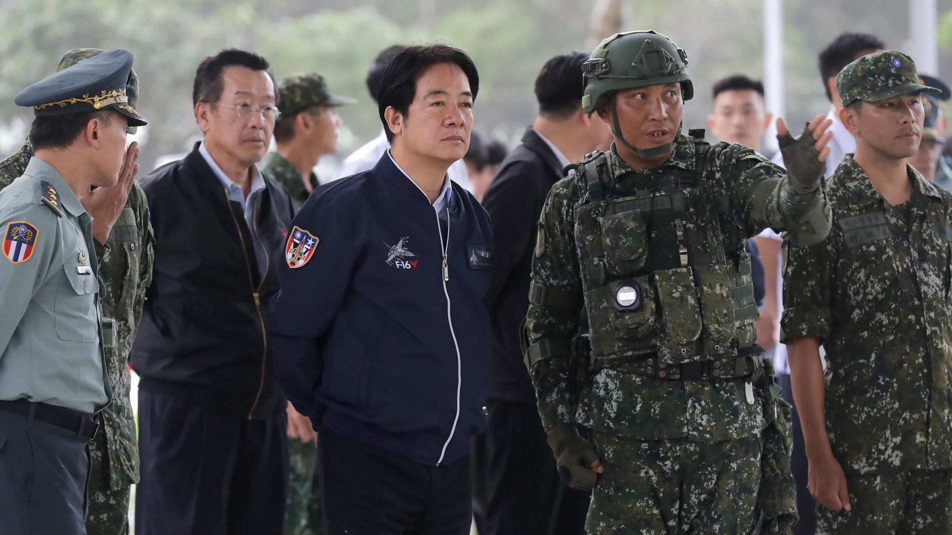 Taiwan President Lai Ching-te, third from left, listens to the briefing during his visit at Taiwanese military in Hualien County, Taiwan, Tuesday, May 28, 2024. The visit came a week after Lai was inaugurated as president. (AP Photo/Chiang Ying-ying)
