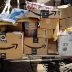 FILE - In this Oct. 10, 2018, file photo Amazon Prime boxes are loaded on a cart for delivery in New York. The nationâ€™s major shipping companies are in the best shape to get holiday shoppersâ€™ packages delivered on time since the start of the pandemic, suggesting a return to normalcy. (AP Photo/Mark Lennihan, File)