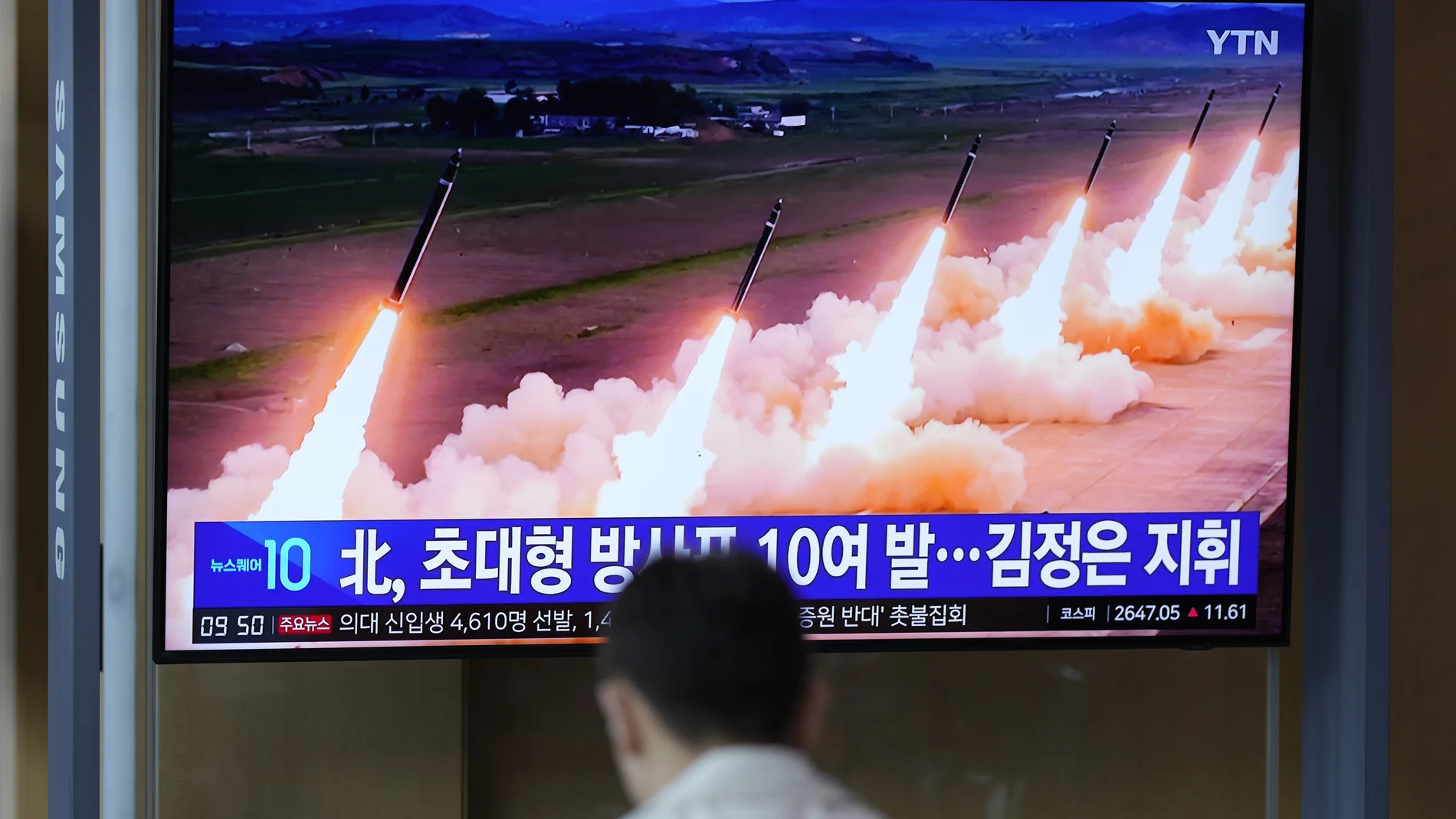 A TV screen shows a report of North Korea's multiple rocket launchers during a news program at the Seoul Railway Station in Seoul, South Korea, Friday, May 31, 2024.