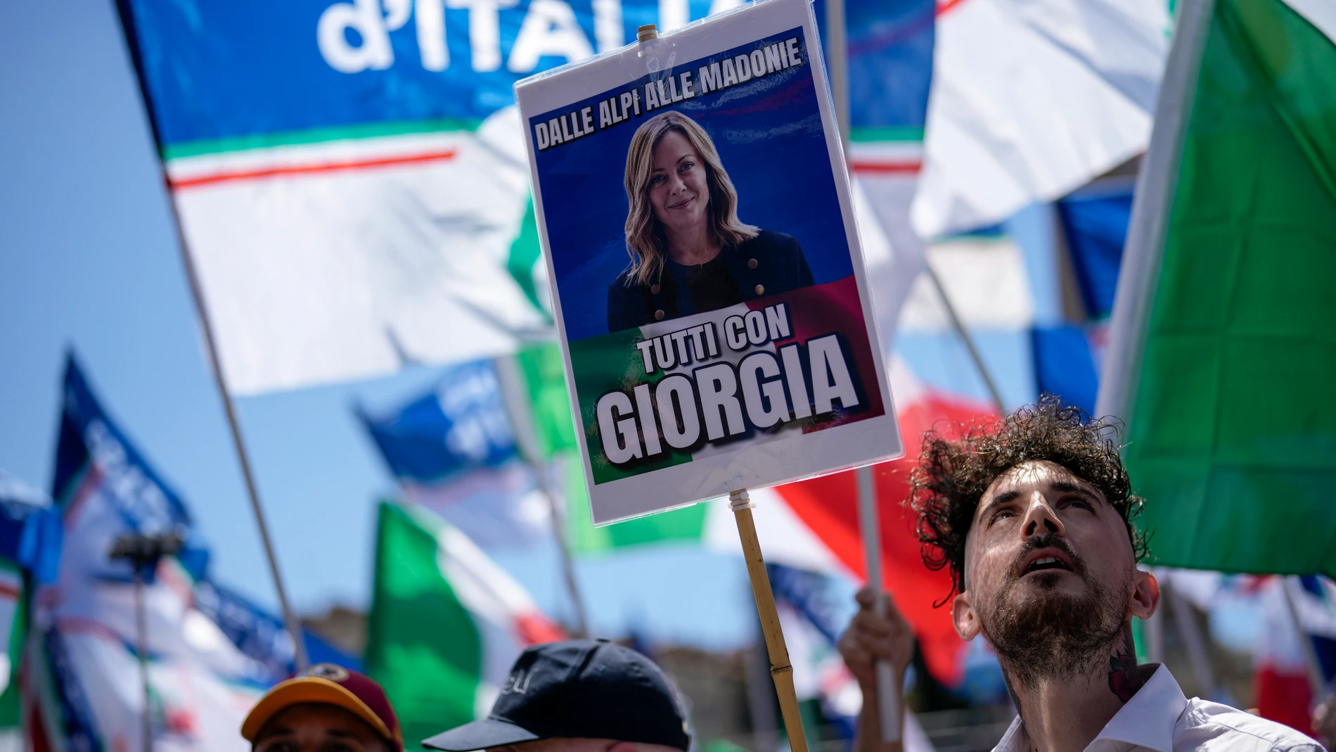 People wait for the arrival of Italian Premier Giorgia Meloni at an electoral rally ahead of the EU parliamentary elections that will take place in Italy on 8 and 9 June, in Rome, Saturday, June 1, 2024. (AP Photo/Alessandra Tarantino)