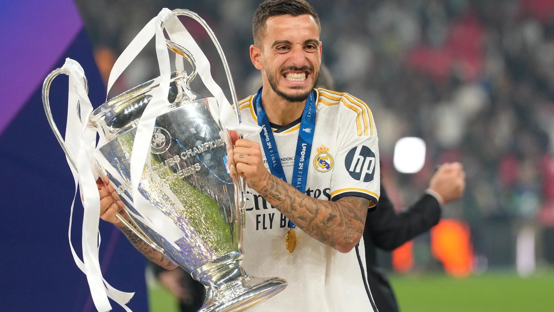 Real Madrid's Joselu celebrates with the trophy after winning the Champions League final soccer match between Borussia Dortmund and Real Madrid at Wembley stadium in London, Saturday, June 1, 2024. (AP Photo/Kirsty Wigglesworth)