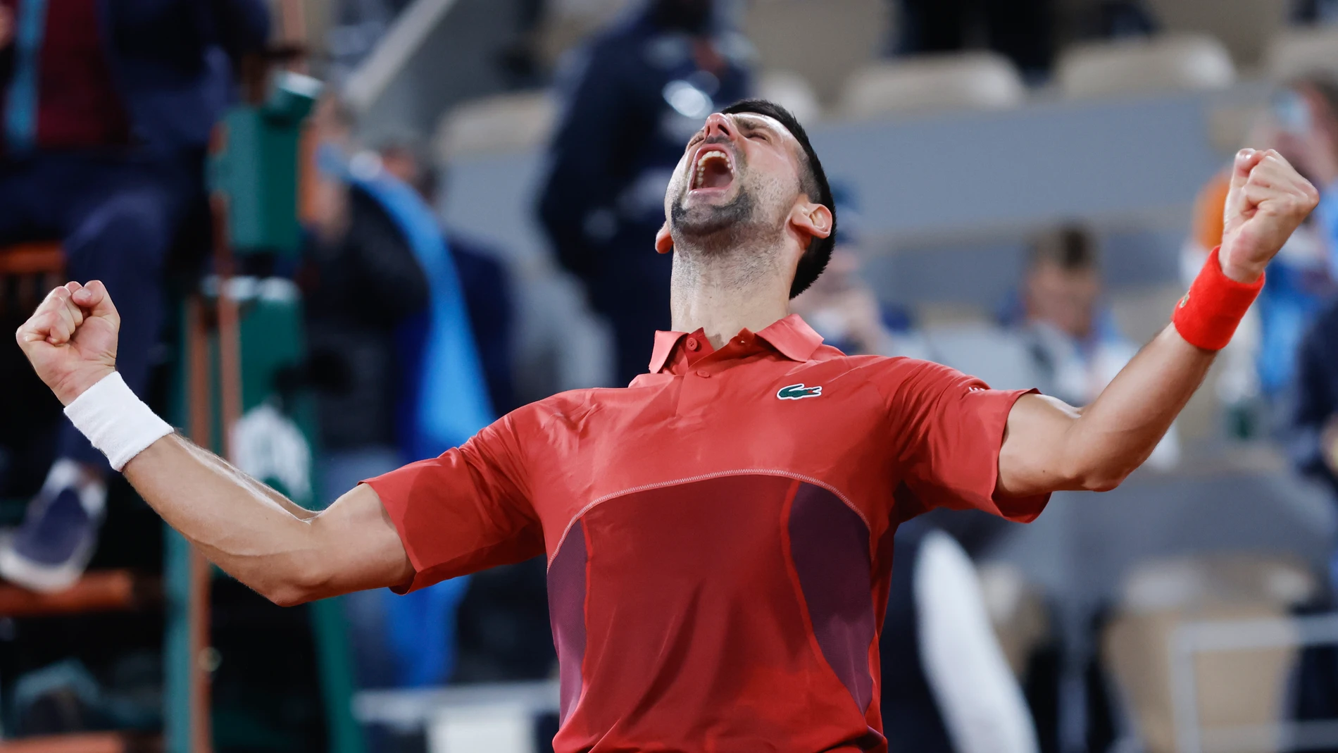 Serbia's Novak Djokovic celebrates winning his third round match of the French Open tennis tournament against Italy's Lorenzo Musetti at the Roland Garros stadium in Paris, Sunday, June 2, 2024. (AP Photo/Jean-Francois Badias)