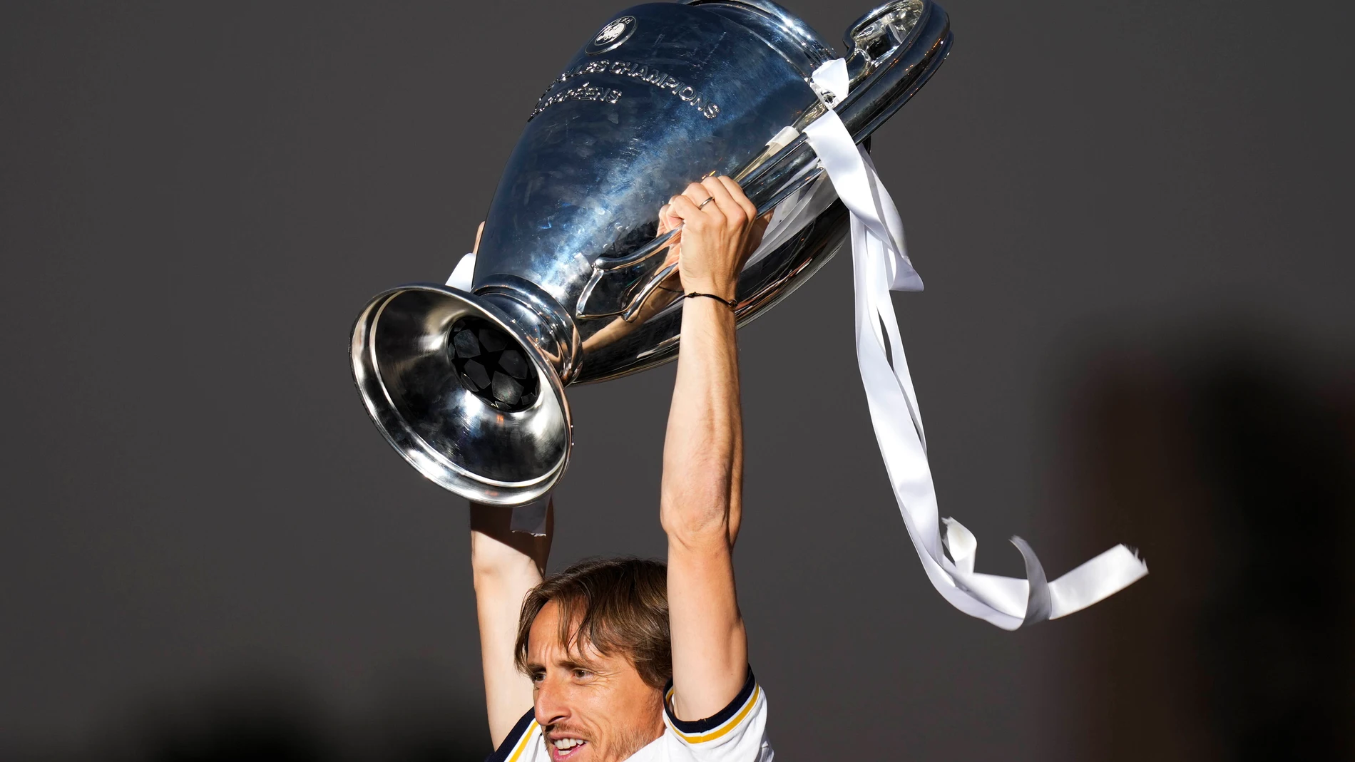 Real Madrid's Luka Modric holds the Champions League trophy at the Cibeles square during a trophy parade in Madrid, Spain, Sunday, June 2, 2024. Real Madrid won against Borussia Dortmund 2-0. (AP Photo/Bernat Armangue)