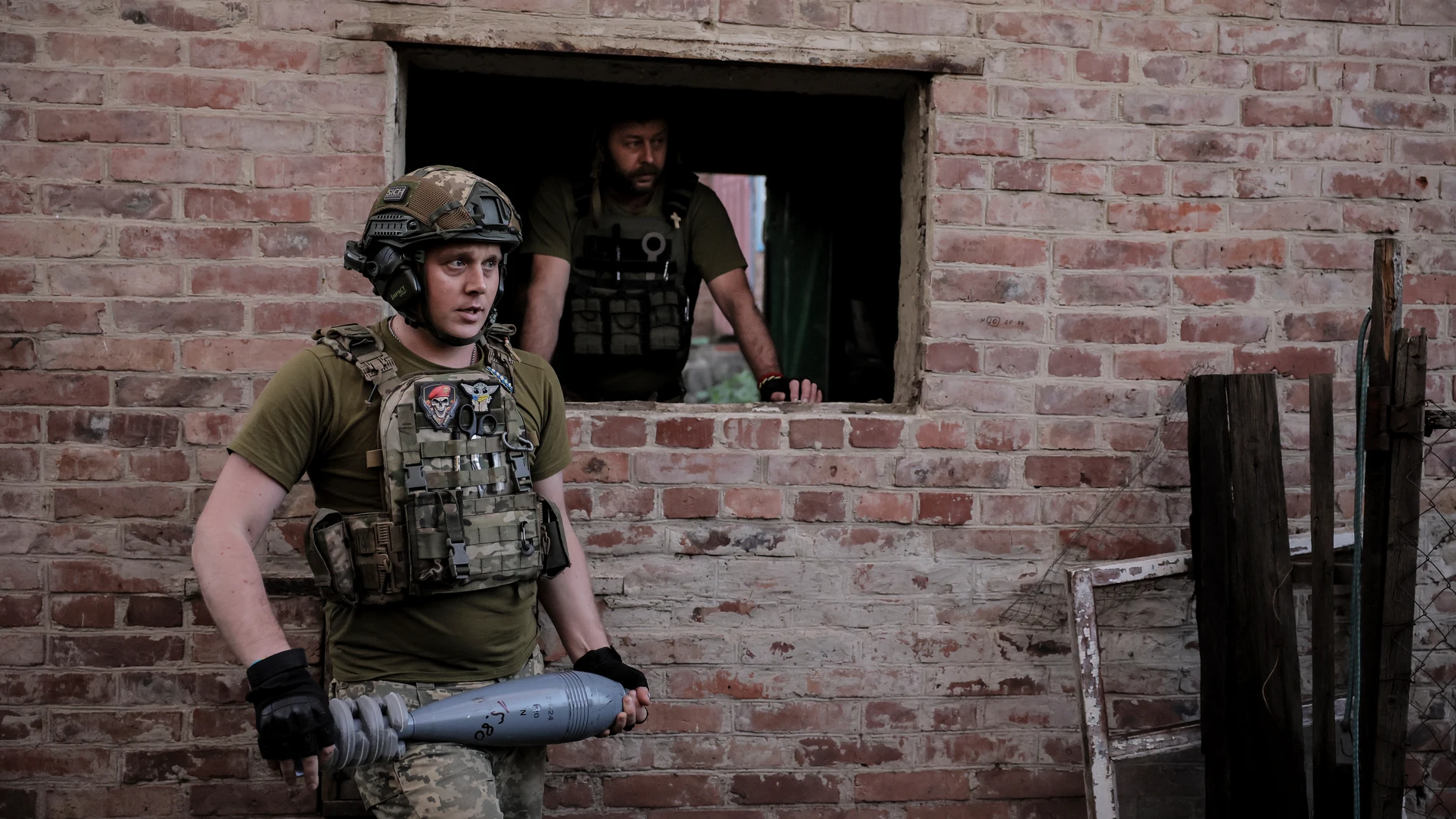 In this photo provided by the 24th Mechanised brigade press service, Ukrainian soldiers prepare to fire 120mm mortar towards Russian position on the front line at undisclosed location in Donetsk region, Ukraine, Monday, June 4, 2024. (Oleg Petrasiuk/Ukrainian 24 Mechanised brigade via AP)