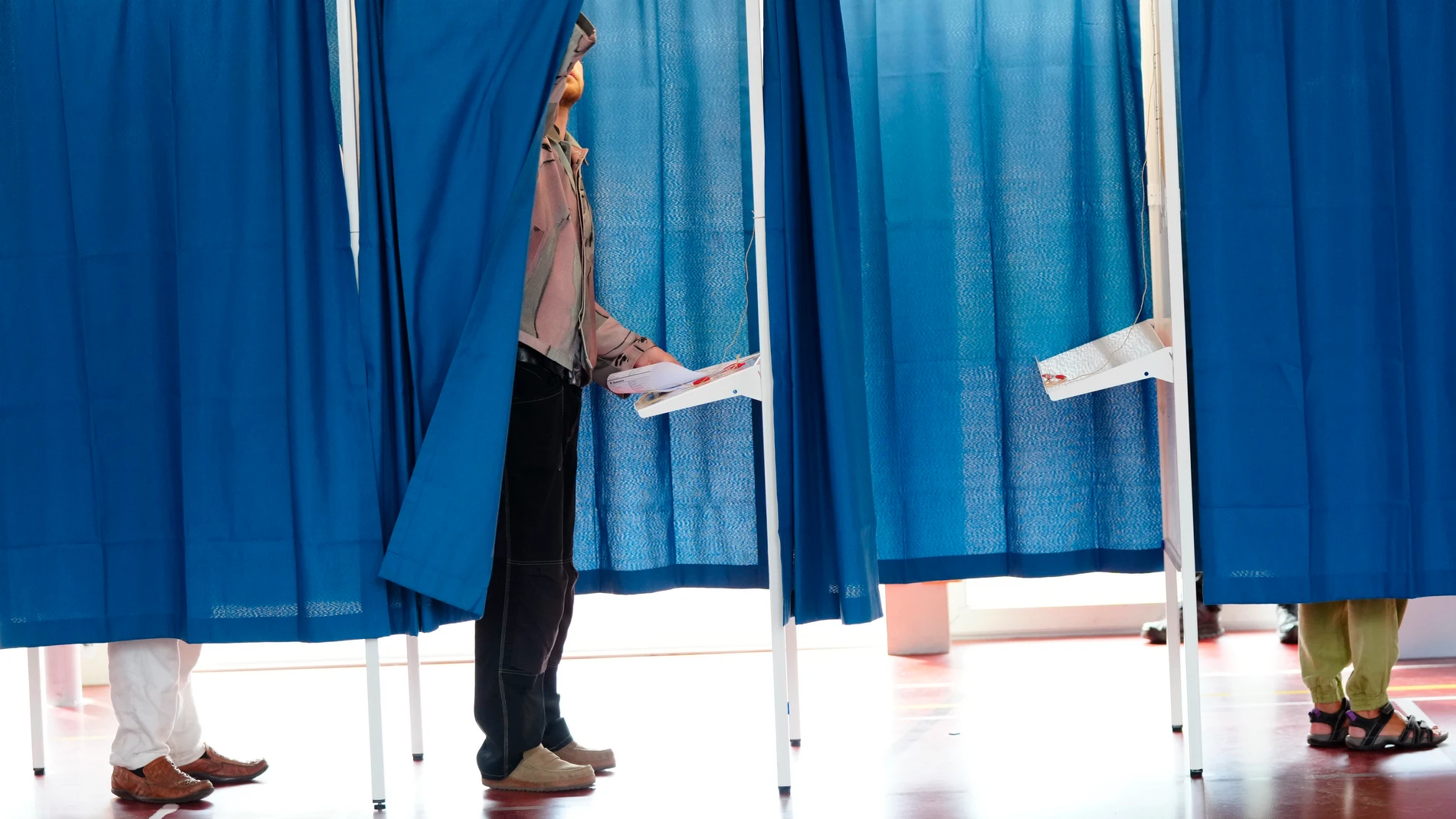 People cast their votes for the European Parliament election, at Nyboder School, in Copenhagen, Denmark, Sunday, June 9, 2024. Polling stations have opened across Europe as voters from 20 countries cast ballots in elections that are expected to shift the European Union’s parliament to the right and could reshape the future direction of the world’s biggest trading bloc. (Ida Marie Odgaard/Ritzau Scanpix via AP)
