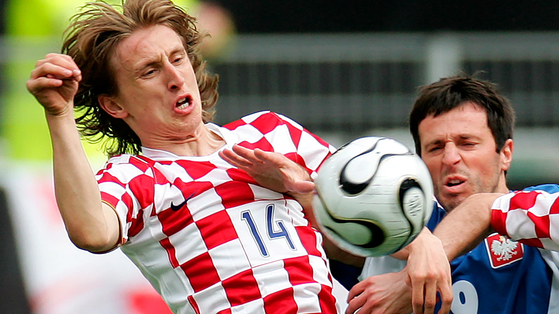 FILE - Croatia's Luka Modric, left, and Poland's Maciej Zurawski challenge for the ball during a friendly soccer match between Poland and Croatia as a preparation for the upcoming soccer World Cup in Wolfsburg, northern Germany, Saturday, June 3, 2006. Portugal's Cristiano Ronaldo and Croatia's Modric go to Euro 2024 showing age is no boundary for soccer's modern stars. (AP Photo/Fabian Bimmer, File)
