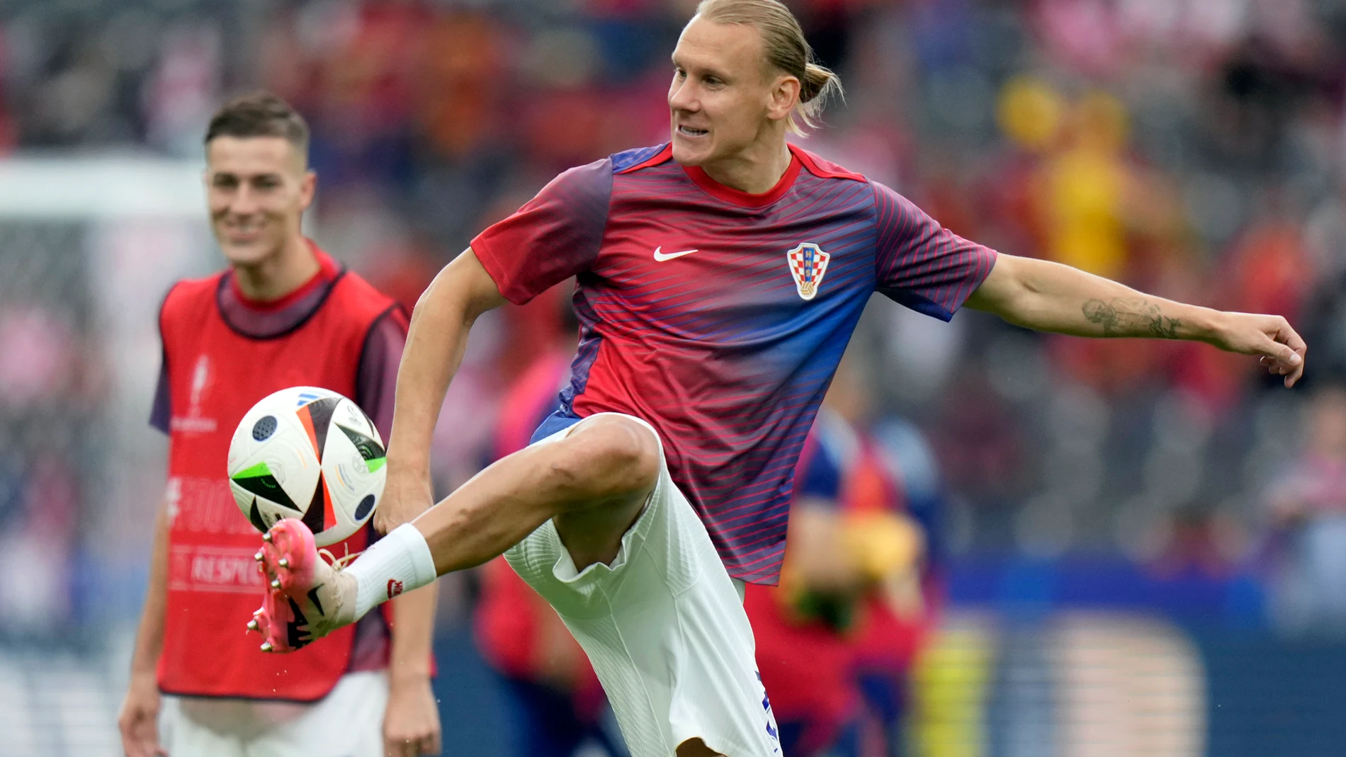 Croatia's Domagoj Vida kicks a ball during warmup before a Group B match between Spain and Croatia at the Euro 2024 soccer tournament in Berlin, Germany, Saturday, June 15, 2024. (AP Photo/Sergei Grits)