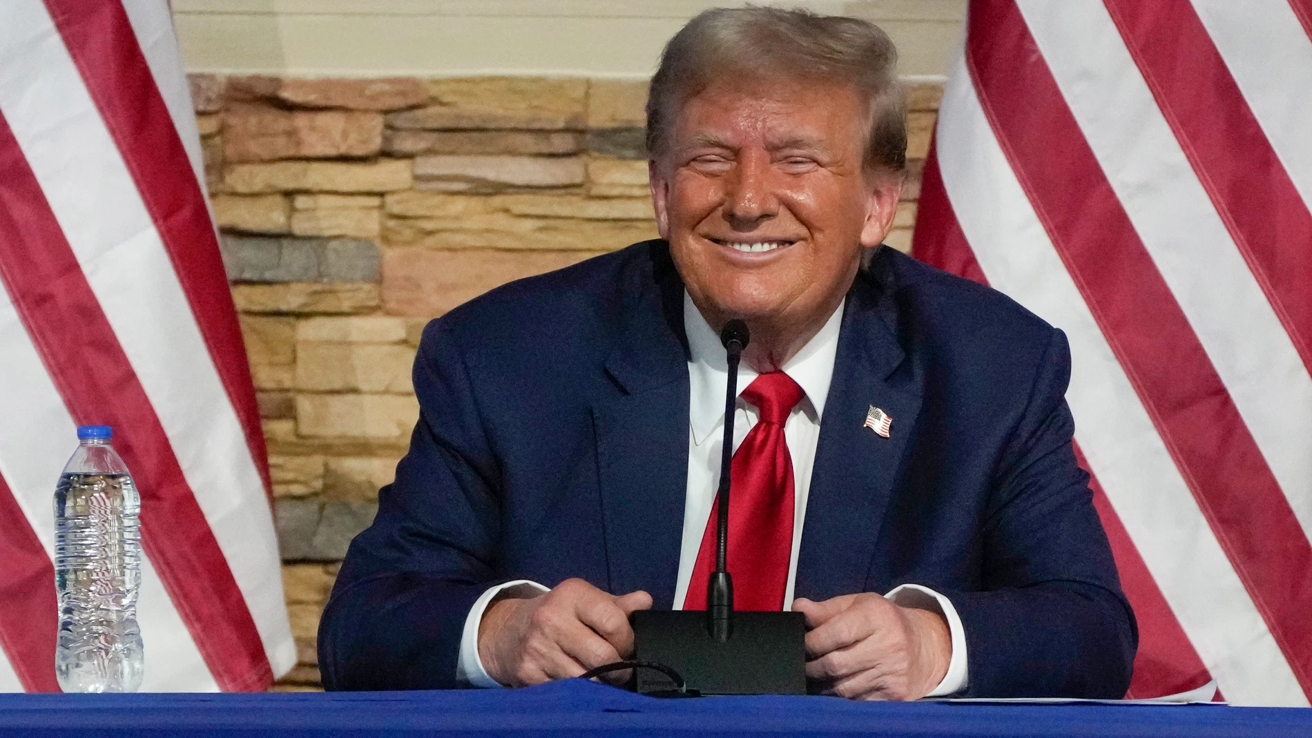 FILE - Republican presidential candidate former President Donald Trump smiles during a campaign event at 180 Church, June 15, 2024, in Detroit. (AP Photo/Carlos Osorio)
